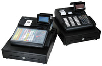 SAM4s SPS-300 Series cash registers: the flat-keyboard model at front left and the raised-key model at rear right, each shown on a cash drawer. Series photograph showing both keyboard configurations, not a single model.